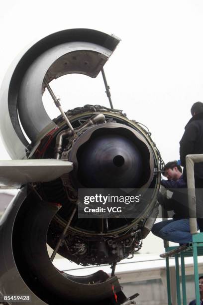 Engineers work on China's first domestically designed and produced passenger jet, the ARJ21, on a production line at a Shanghai Aircraft...