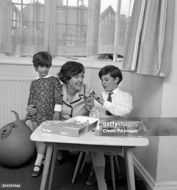 Madeleine Simms of the Abortion Law Reform Association, with her children Nicholas and Harriet in their home in Golders Green, London.