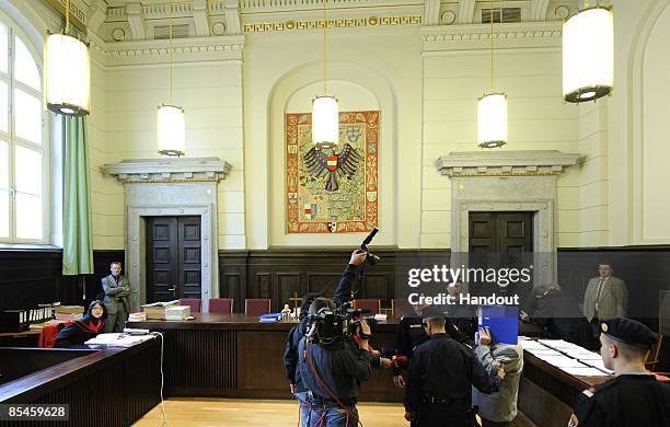 In this handout picture Josef Fritzl covers his face as he arrives at the second day of his trial at the country court of St. Poelten on March 17,...