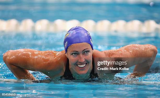 Therese Alshammar of Sweden leaves the pool after breaking the world record in the women's 50 metre butterfly during day one of the 2009 Australian...