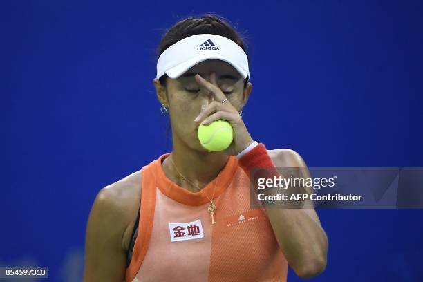 Wang Qiang of China reacts after losing a point against Karolina Pliskova of Czech Repubic during their third round women's singles match at the WTA...