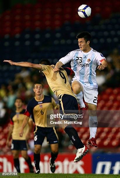 Sasho Petrovski of the Jets and Kim Dongkyu of Ulsan clash during the AFC Champions League Group E match between the Newcastle Jets and Ulsan Hyundai...