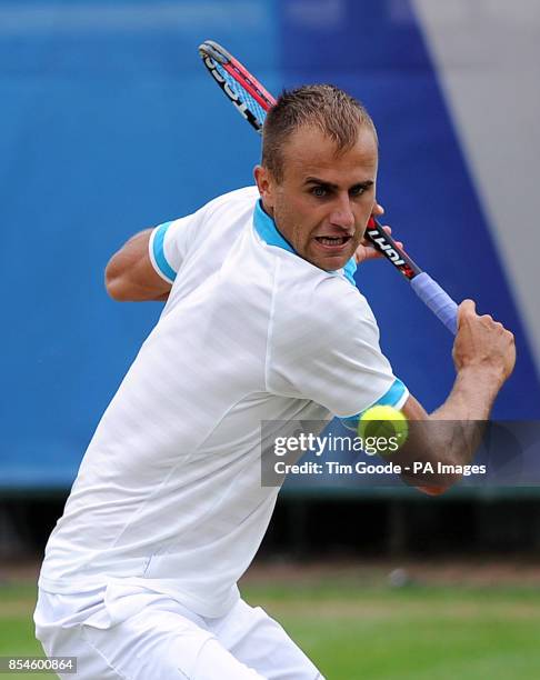 Romania's Marius Copil in action against Great Britain's Marcus Willis during the AEGON Nottingham Challenge at The Nottingham Tennis Centre,...