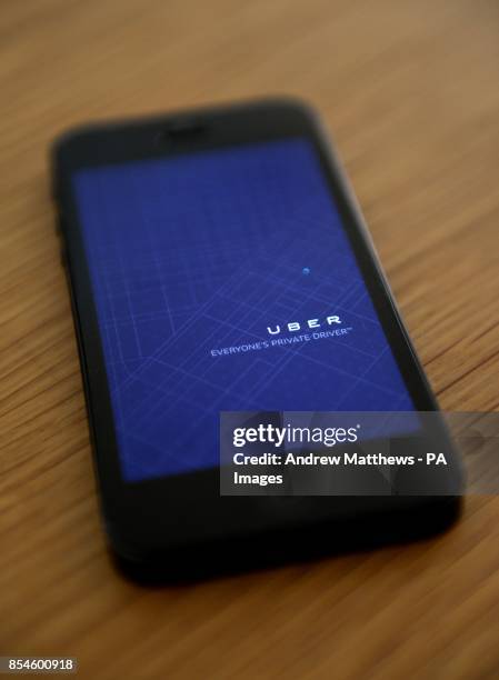 The Uber app being used on an Apple iPhone 5, as a row has flared over the introduction of the app which allows customers to book and track vehicles.