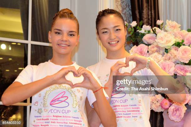 Kaho Minagawa of Japan and Dina Averina of Russia pose for photographs during a press conference ahead of the Rhythmic Gymnastics AEON Cup on...