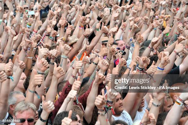 Rock fans show their support for cancer charity fundraiser Stephen Sutton with a thumbs up salute in front of the Main Stage, the Stephen Sutton...