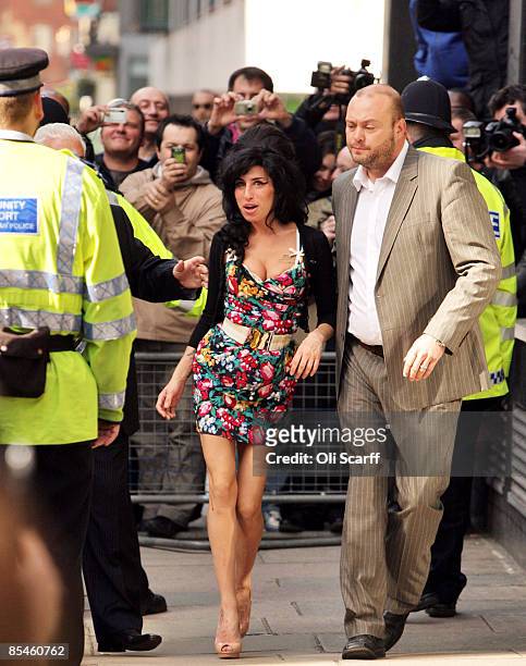 Singer Amy Winehouse attends Westminster Magistrates Court to face charges of common assault on March 17, 2009 in London, England. The soul singer is...