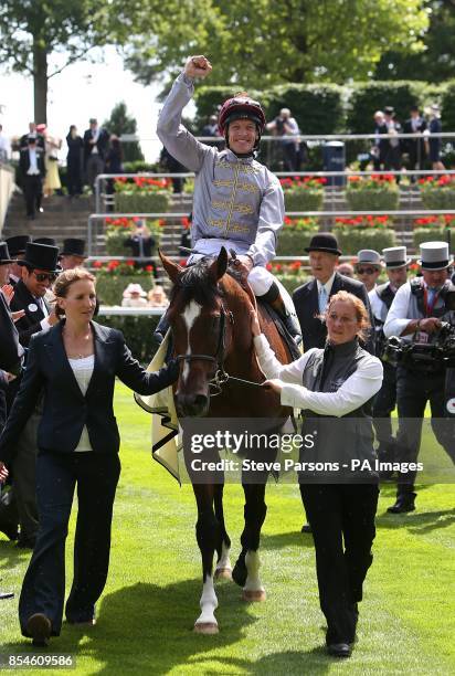 Jockey Richard Hughes celebrates winning the Queen Anne Stakes with Toronado, during Day One of the 2014 Royal Ascot Meeting at Ascot Racecourse,...