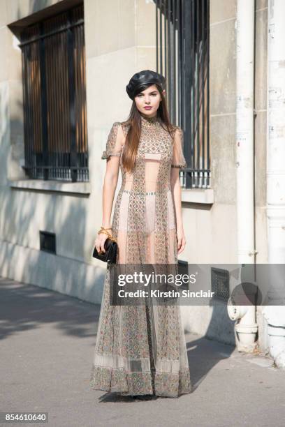 Fashion blogger Diona Ciobanu wears a Dior dress, hat, bag, shoes and underwear day 1 of Paris Womens Fashion Week Spring/Summer 2018, on September...