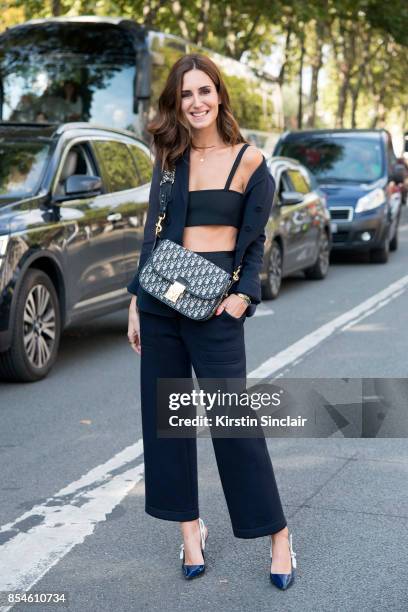 Fashion blogger Gala Gonzalez wears a Dior suit, top, bag and shoes day 1 of Paris Womens Fashion Week Spring/Summer 2018, on September 26, 2017 in...