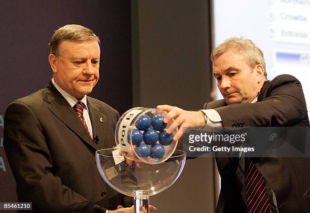 Mirca Sandu chairman of UEFA women's football committee and UEFA general secretary David Taylor holds a pot of teams during the FIFA Women's Cup 2011...