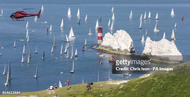 Spectators watch the fleet from the cliffs above The Needles during the J P Morgan Asset Management Round The Island Race.