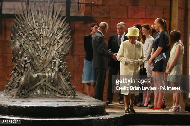 Queen Elizabeth II and the Duke of Edinburgh during a visit to the set of Game of Thrones on day two of a visit to Northern Ireland.