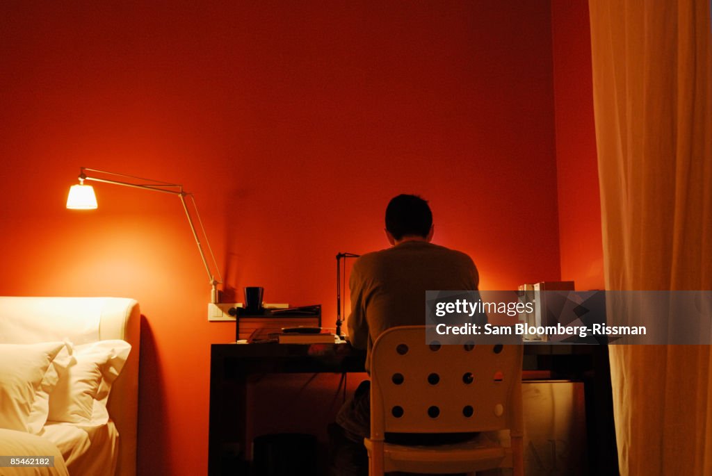 Man writing at a desk
