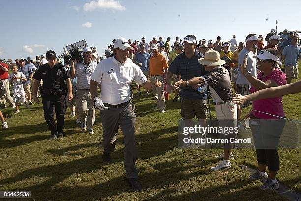 Championship: Phil Mickelson fist bump with fans in gallery after Sunday play at Blue Monster Course of Doral Resort & Spa. Doral, FL 3/15/2009...