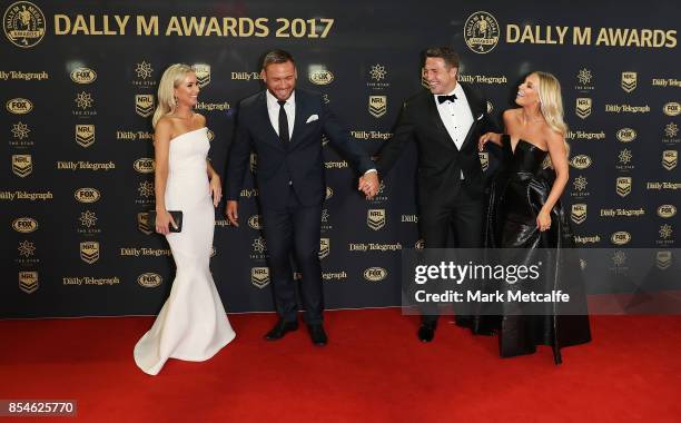 Sam Burgess and Phoebe Burgess laugh with Jared Waerea-Hargreaves and Chelsea Waerea-Hargreave ahead of the 2017 Dally M Awards at The Star on...