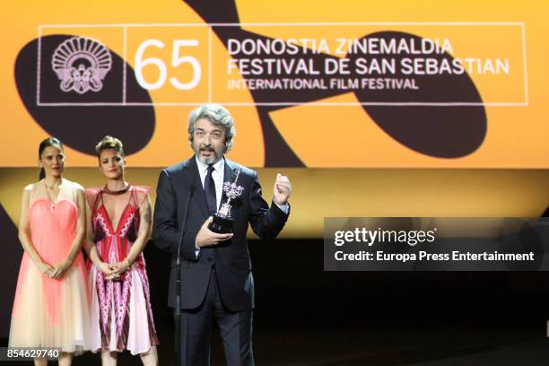 Ricardo Darin receives from the hands of Elena Anaya and Dolores Fonzi the Donostia Award Gala during 65th San Sebastian Film Festival on September...