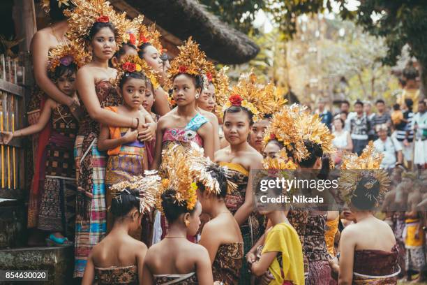 group of beautiful balinese women dancers in traditional costumes - bali dancing stock pictures, royalty-free photos & images