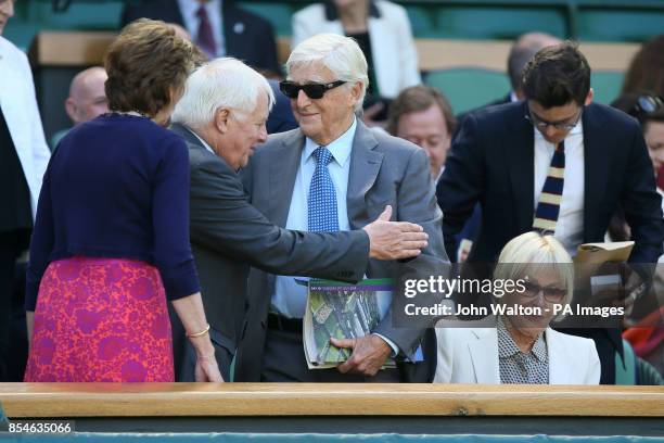 Sir Michael Parkinson and his wife Lady Mary arrive in the Royal Box on Centre Court during day eleven of the Wimbledon Championships at the All...
