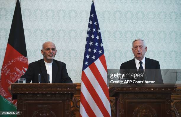 Defense Secretary Jim Mattis speaks next to Afghan President Ashraf Ghani during a press conference at the Presidential Palace in Kabul on September...