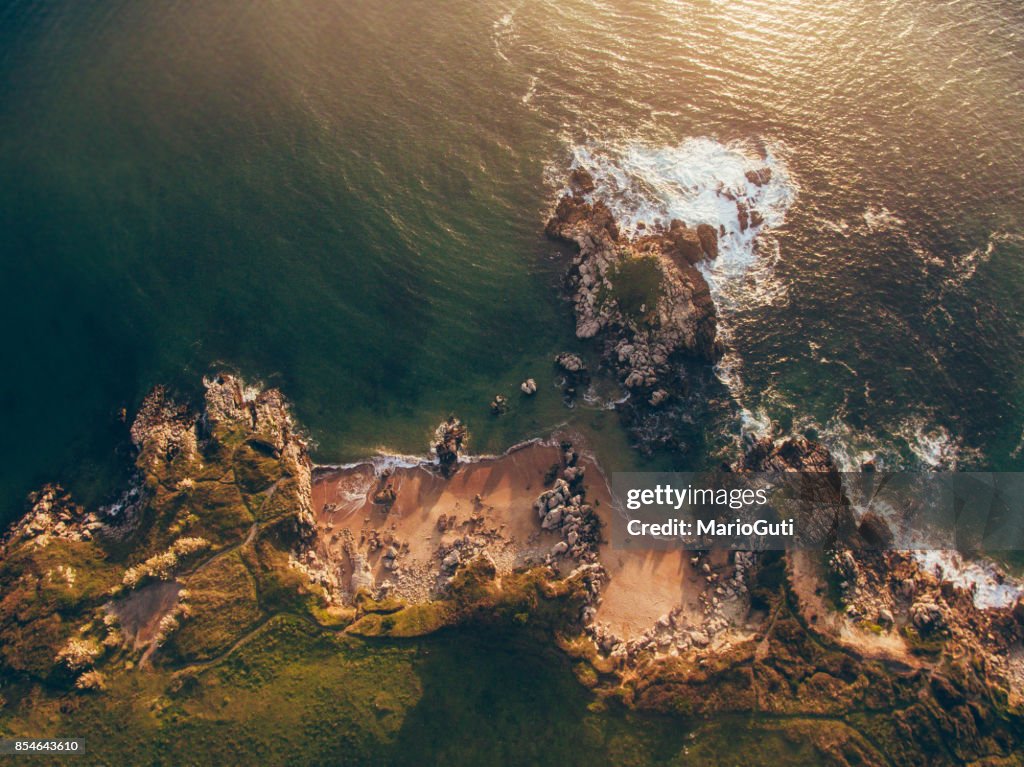 Aerial view of small rocky beach