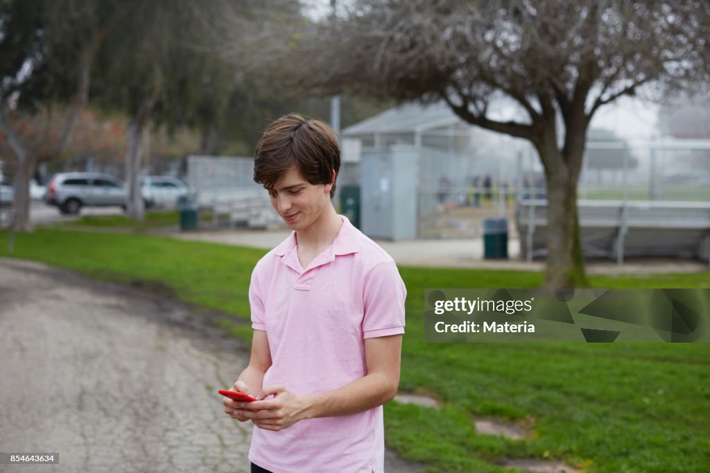 Boy Send Msg Teenage Boy Sends Text Message On Cellphone High-Res Stock Photo ...