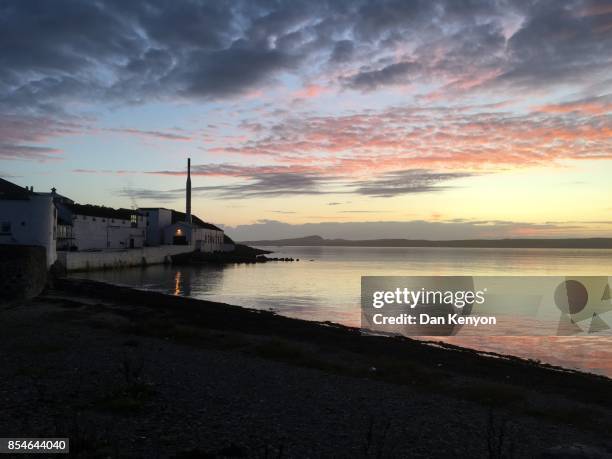 sunset. bowmore whisky distillery.  islay. scotland. - scotland distillery stock pictures, royalty-free photos & images