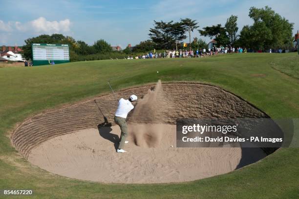 Australia's Adam Scott chips out of a bunker on the 10th hole during day one of the 2014 Open Championship at Royal Liverpool Golf Club, Hoylake.