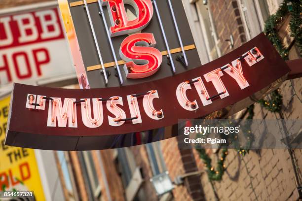 music city neon lights nashville, tennessee usa - nashville stock pictures, royalty-free photos & images