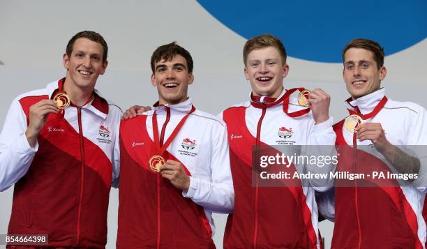 England's Adam Brown, Adam Barrett, Adam Peaty and Chris Walker-Hebborn collect their gold medals for the Men's 4 x 100m Medley Relay Final, at...