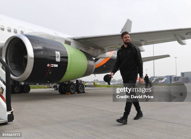 Olivier Giroud of Arsenal board the plane at Luton Airport on September 27, 2017 in Luton, England.