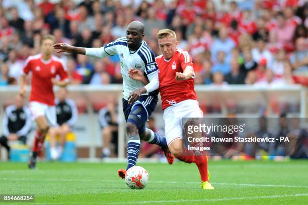 Nottingham Forest's Ben Osborn and West Brom's Youssouf Mulumbu battle for the ball during the Pre-Season friendly at The City Ground, Nottingham.