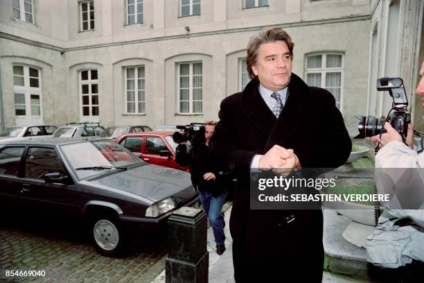 Olympique Marseille owner Bernard Tapie arrives at the Valenciennes courthouse on October 19, 1993 after being heard by investigating magistrate...