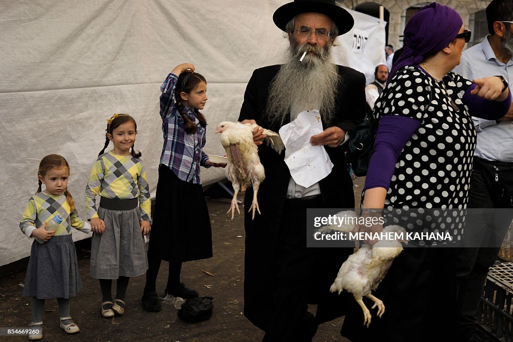 Kaparot Ritual Ultra-Orthodox Jews hold chickens before performing the Kaparot... News ...