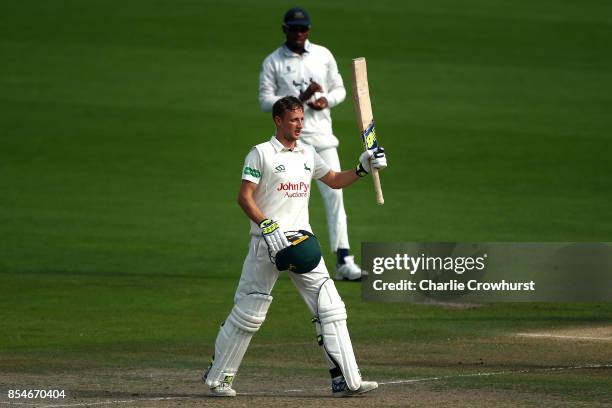 Billy Root of Nottinghamshire celebrates his century during day three of the Specsavers County Championship Division Two match between Sussex and...