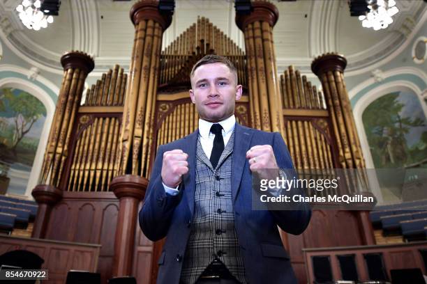 Carl Frampton poses for photographers in front of the famous Ulster Hall organ as he attends a press conference to announce details of his...