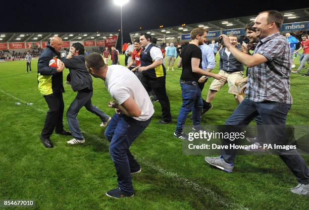 The steward pinches the ball and run-ins the after game kick around during the pre-season friendly at the AJ Bell Stadium, Salford.