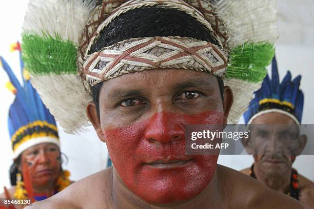 Brazilian natives from the Makunaimi tribe take part in a demonstration outside the Supreme Federal Court on March 17, 2009 in Brasilia, on the eve...