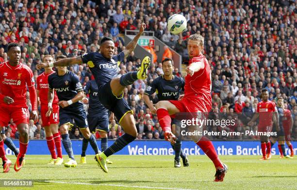 Southampton's Nathaniel Clyne and Liverpool's Rickie Lambert battle for the ball during the Barclays Premier League match at Anfield, Liverpool.