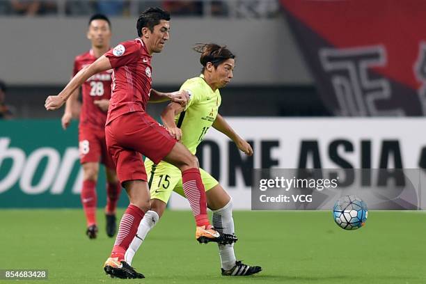 Odil Ahmedov of Shanghai SIPG kicks the ball during 2017 AFC Champions League semifinal first leg match between Shanghai SIPG and Urawa Red Diamonds...