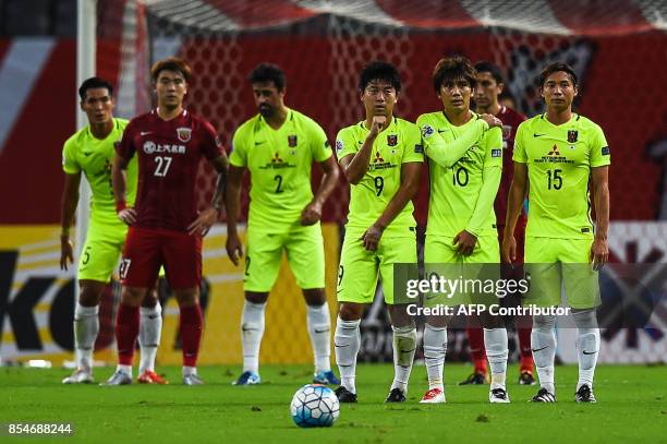 Urawa' players take position for free hit during the AFC Champions League semi-final football match between Shanghai SIPG FC and Urawa Red Diamonds...