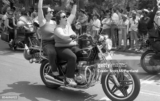Activists from the LGBTQ community ride their motorcycles with fists in the air at the start of the Gay Pride Parade, commemorating the 20th...