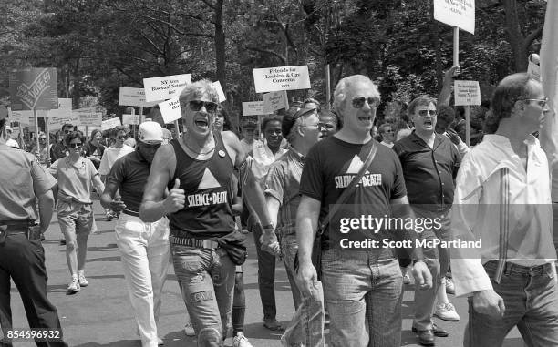 Man enthusiastically gives a "Thumbs Up" to the camera, at the 1989 Gay Pride Parade in Greenwich Village, Manhattan commemorating the 20th...