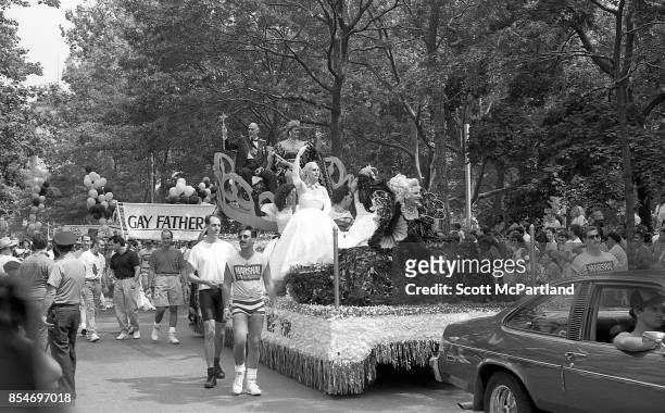 Crowded parade floats line the streets around Washington Square Park during the 1989 Gay Pride Parade in NYC commemorating the 20th anniversary of...