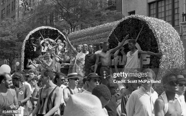 Gay rights activists smile and wave to the crowd from a parade float during the 1989 Gay Pride Parade in Greenwich Village, Manhattan commemorating...