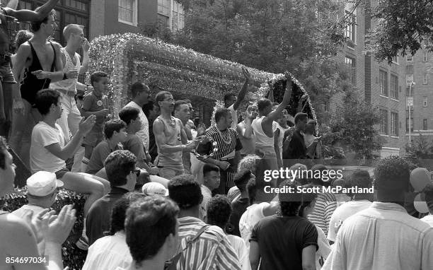 Gay rights activists smile and wave to the crowd from a parade float during the 1989 Gay Pride Parade in Greenwich Village, Manhattan commemorating...