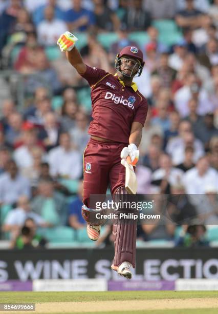 Evin Lewis of the West Indies celebrates reaching his century during the 4th Royal London one-day international cricket match between England and the...