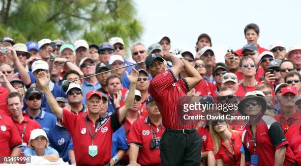 Tiger Woods of the U.S. And the Isleworth Team hits his tee shot at the eighth hole during the second day of the 2009 Tavistock Cup at the Lake Nona...