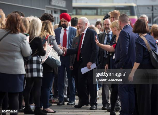 Leader of Labour Party Jeremy Corbyn is greeted by delegates as he arrives to deliver his keynote speech at the Labour Party on the annual conference...