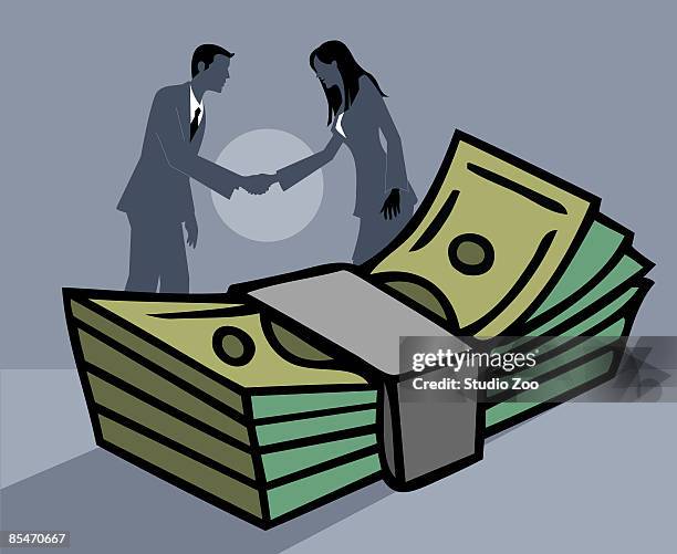 a businessman and businesswoman shaking hands in front of a bundle of paper money - bundle deal stock illustrations